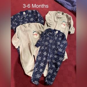Two sets matching footie pajamas. New without tags. 3-6 months.